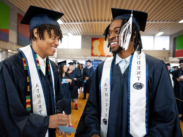 Two Penn State Abington student athletes celebrate their graduation